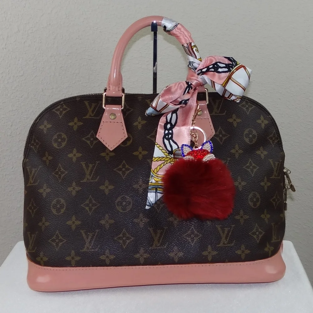 Louis Vuitton Brown Monogram Satchel with Pink Trim and Red Pom-Pom Charm